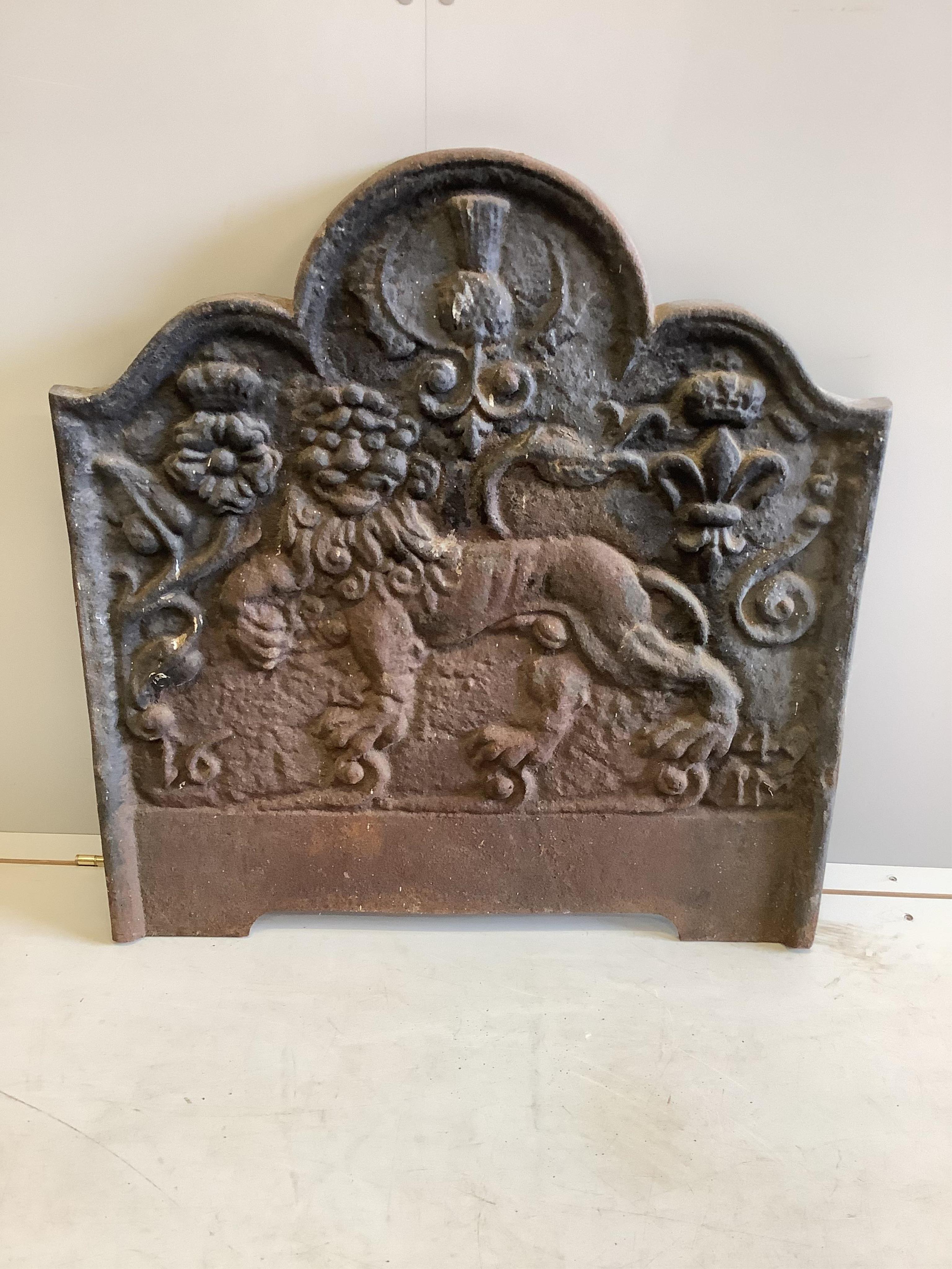 A cast iron fire back, width 75cm, height 79cm. Condition - fair